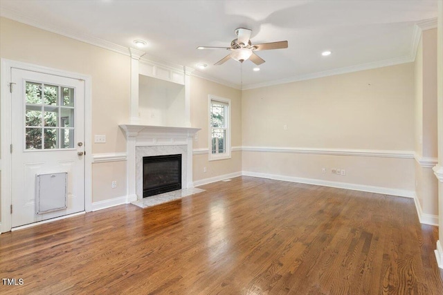109 Gullane Ct, Apex, NC 27502 - unfurnished living room with healthy amount of natural light, ceiling fan, a premium fireplace, wood finished floors, and crown molding