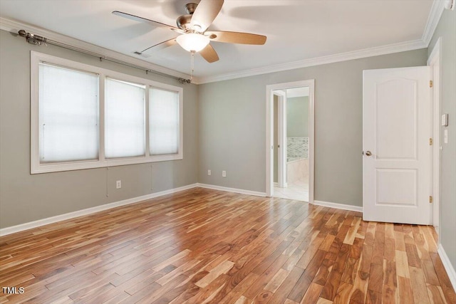 109 Gullane Ct, Apex, NC 27502 - spare room with light wood-style floors, a ceiling fan, and ornamental molding