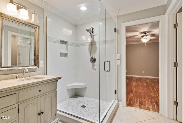 109 Gullane Ct, Apex, NC 27502 - full bath featuring ornamental molding, a stall shower, ceiling fan, wood finished floors, and vanity