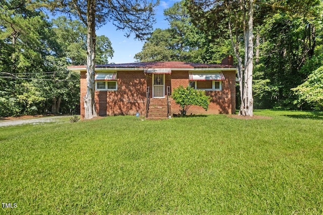 3702 Danube Ln, Durham, NC 27704 - ranch-style home featuring a front lawn, brick siding, and a chimney