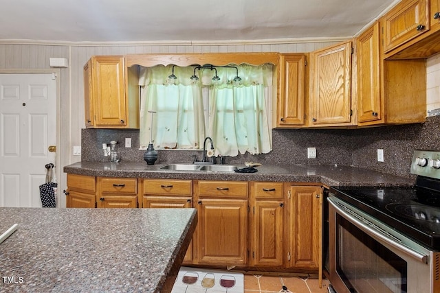 3702 Danube Ln, Durham, NC 27704 - kitchen featuring stainless steel electric range, dark countertops, light tile patterned flooring, and backsplash