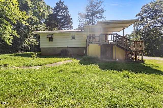 3702 Danube Ln, Durham, NC 27704 - back of property featuring stairway, a deck, and a yard