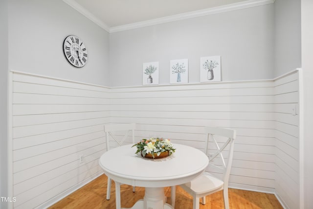105 Fountain Ridge Pl, Holly Springs, NC 27540 - dining room featuring wood finished floors, crown molding, and wood walls