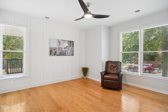 105 Fountain Ridge Pl, Holly Springs, NC 27540 - unfurnished room featuring light wood finished floors, a ceiling fan, and a decorative wall