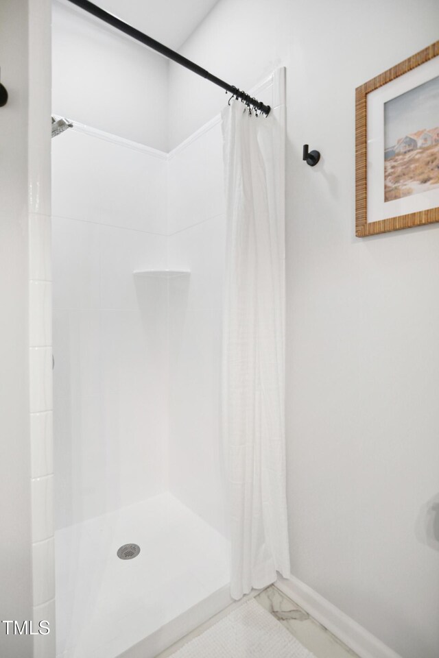 105 Fountain Ridge Pl, Holly Springs, NC 27540 - bathroom with a shower with shower curtain and marble look tile flooring