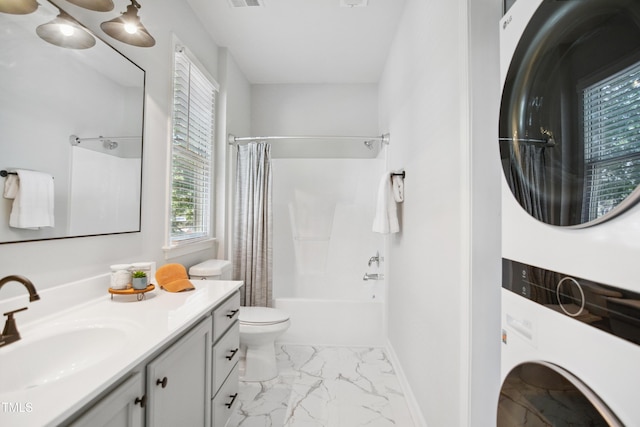 105 Fountain Ridge Pl, Holly Springs, NC 27540 - bathroom featuring estacked washer and dryer, marble look tile flooring, shower / bath combo with shower curtain, and vanity