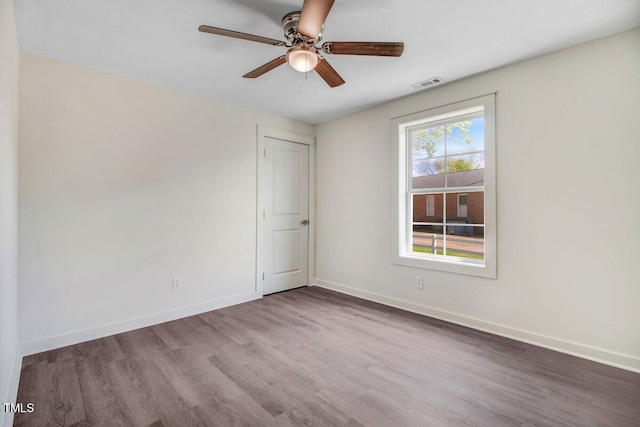 400 E Townsend St, Dunn, NC 28334 - unfurnished room with wood finished floors and ceiling fan