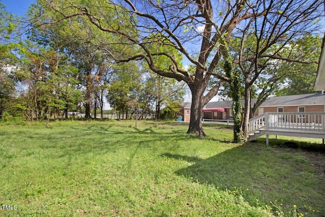 400 E Townsend St, Dunn, NC 28334 - view of green lawn featuring a wooden deck