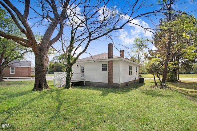 400 E Townsend St, Dunn, NC 28334 - view of side of property featuring a chimney and a yard