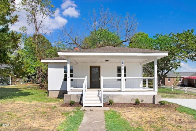 400 E Townsend St, Dunn, NC 28334 - bungalow-style home with a porch and roof with shingles