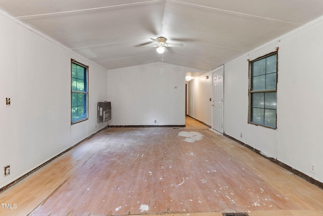 3170 Loblolly Ln, Wake Forest, NC 27587 - spare room featuring heating unit, hardwood / wood-style flooring, vaulted ceiling, and a ceiling fan