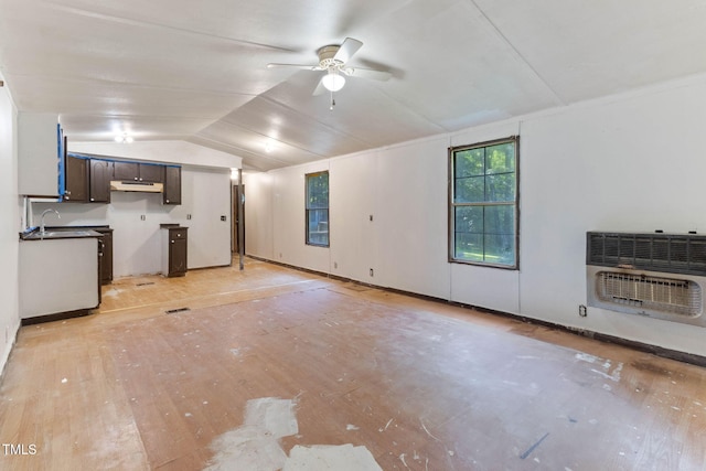 3170 Loblolly Ln, Wake Forest, NC 27587 - unfurnished living room featuring heating unit, light wood-style flooring, lofted ceiling, and a ceiling fan