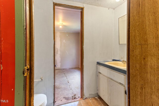 3170 Loblolly Ln, Wake Forest, NC 27587 - bathroom with vanity and a textured ceiling