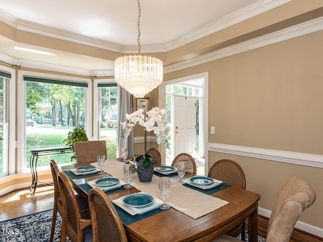 5032 Salem Ridge Rd, Holly Springs, NC 27540 - dining room with a chandelier, wood finished floors, and crown molding