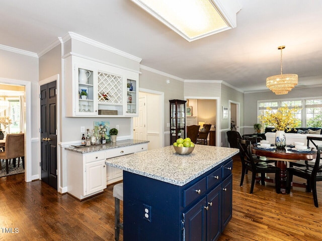 5032 Salem Ridge Rd, Holly Springs, NC 27540 - kitchen with blue cabinets, a chandelier, white cabinets, dark wood-type flooring, and ornamental molding