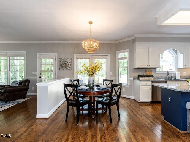 5032 Salem Ridge Rd, Holly Springs, NC 27540 - dining area featuring dark wood finished floors, a chandelier, and crown molding