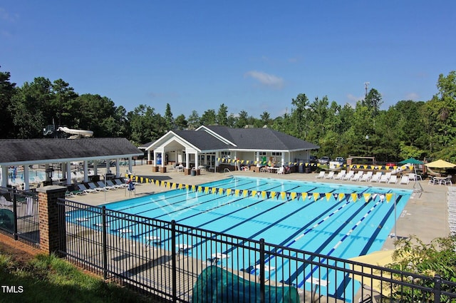 5032 Salem Ridge Rd, Holly Springs, NC 27540 - community pool with a patio area and view of wooded area