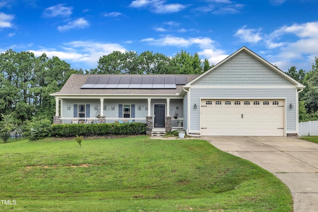115 Creech Place Dr, Benson, NC 27504 - craftsman house featuring covered porch, a front lawn, solar panels, concrete driveway, and an attached garage