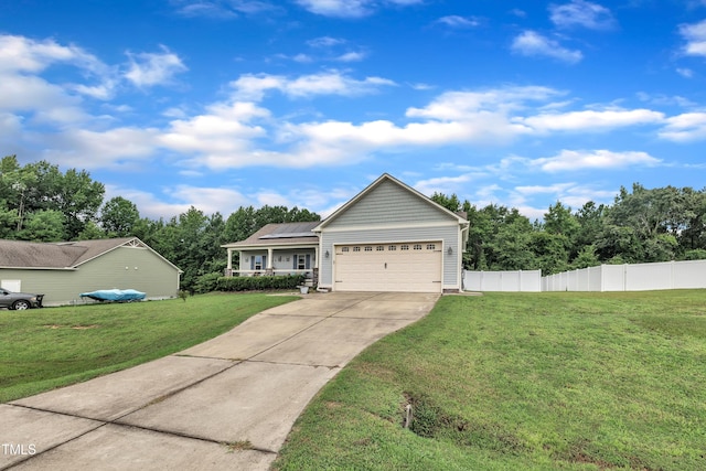 115 Creech Place Dr, Benson, NC 27504 - view of front facade featuring concrete driveway, an attached garage, and solar panels