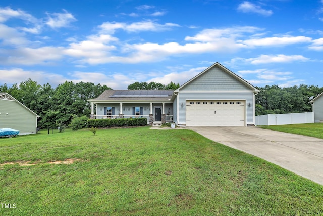 115 Creech Place Dr, Benson, NC 27504 - view of front of house featuring covered porch, a garage, concrete driveway, and solar panels