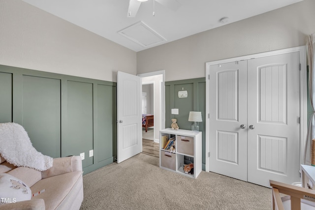 115 Creech Place Dr, Benson, NC 27504 - sitting room with a decorative wall, light colored carpet, attic access, a ceiling fan, and a wainscoted wall