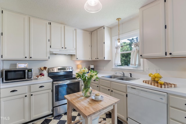 107 Leighton Pl, Knightdale, NC 27545 - kitchen featuring stainless steel appliances, under cabinet range hood, light countertops, white cabinets, and pendant lighting