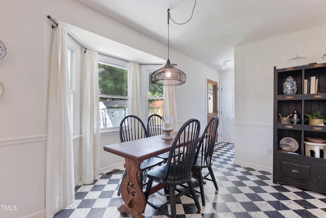 107 Leighton Pl, Knightdale, NC 27545 - dining area with dark floors and a textured ceiling