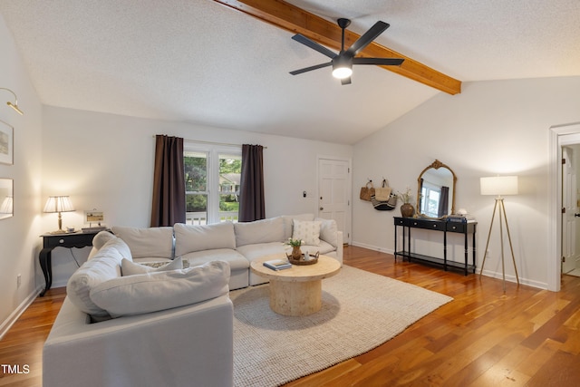 107 Leighton Pl, Knightdale, NC 27545 - living room with ceiling fan, wood finished floors, and a textured ceiling