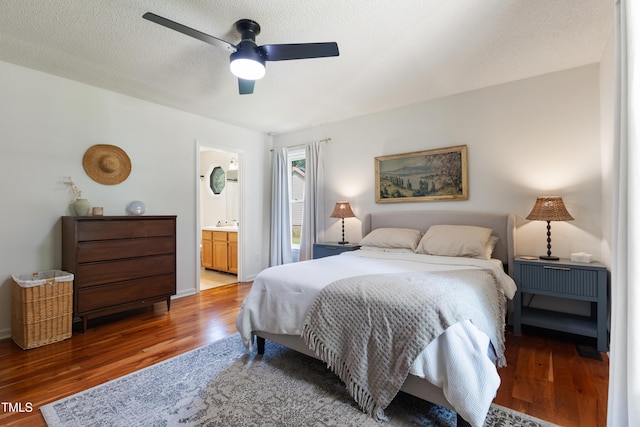107 Leighton Pl, Knightdale, NC 27545 - bedroom featuring light wood-type flooring, ensuite bath, a ceiling fan, and a textured ceiling