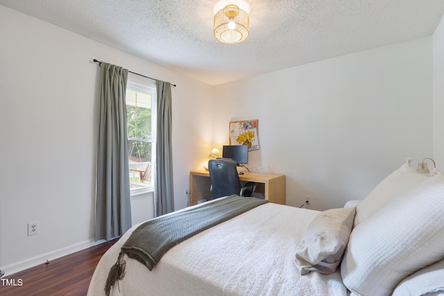 107 Leighton Pl, Knightdale, NC 27545 - bedroom featuring dark wood finished floors and a textured ceiling