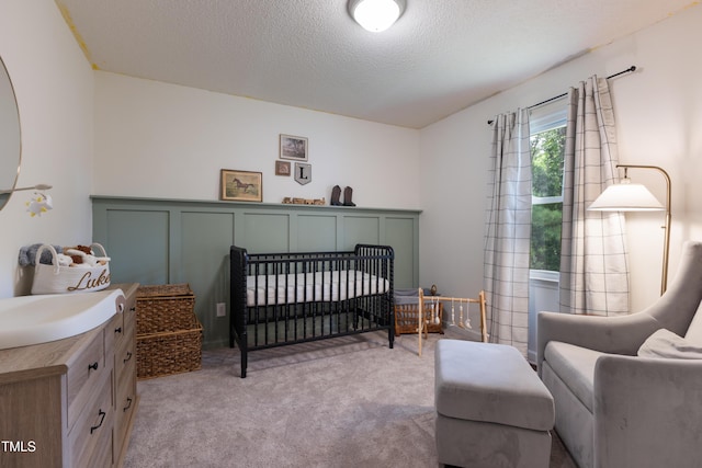 107 Leighton Pl, Knightdale, NC 27545 - carpeted bedroom with a nursery area and a textured ceiling