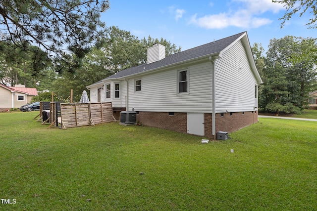 107 Leighton Pl, Knightdale, NC 27545 - rear view of house with crawl space, a yard, and a chimney