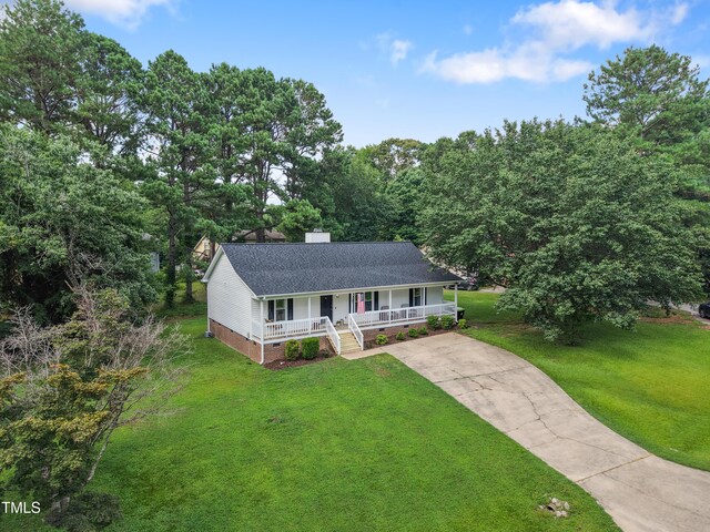107 Leighton Pl, Knightdale, NC 27545 - view of front of home with a porch, crawl space, concrete driveway, a front lawn, and a chimney