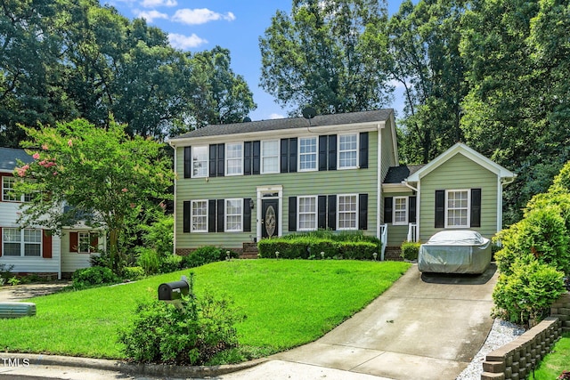 501 Dandelion Ct, Raleigh, NC 27610 - colonial inspired home featuring a front yard and concrete driveway