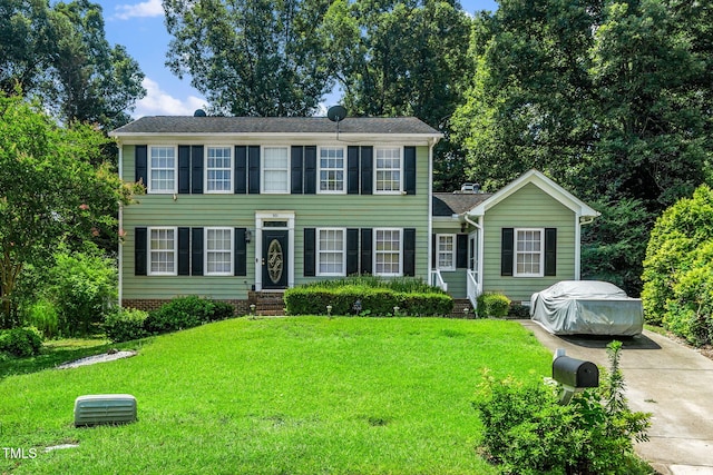 501 Dandelion Ct, Raleigh, NC 27610 - colonial-style house with entry steps and a front lawn