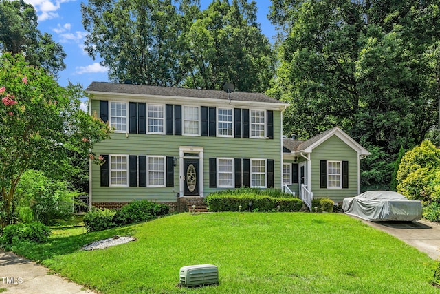 501 Dandelion Ct, Raleigh, NC 27610 - colonial-style house featuring entry steps and a front lawn