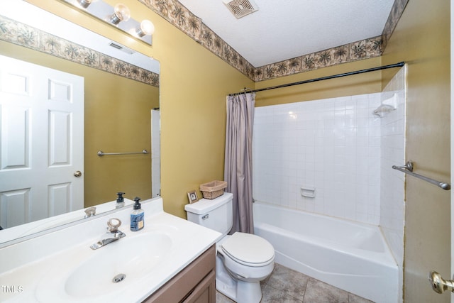 501 Dandelion Ct, Raleigh, NC 27610 - bathroom featuring vanity, shower / bath combo with shower curtain, tile patterned flooring, and a textured ceiling