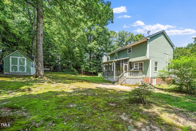501 Dandelion Ct, Raleigh, NC 27610 - rear view of house featuring a sunroom, a shed, and a yard