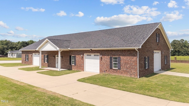 7390 NC-50, Angier, NC 27501 - view of front of property featuring a front yard, brick siding, roof with shingles, and concrete driveway