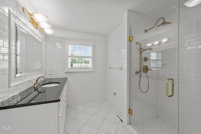 7390 NC-50, Angier, NC 27501 - full bathroom featuring vanity, a stall shower, tile patterned flooring, and a textured ceiling