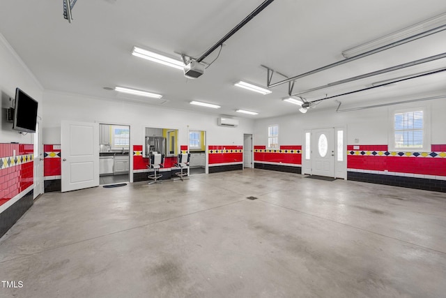 7390 NC-50, Angier, NC 27501 - garage featuring a wall unit AC, a garage door opener, and stainless steel fridge with ice dispenser