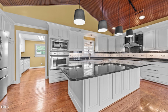 7390 NC-50, Angier, NC 27501 - kitchen featuring appliances with stainless steel finishes, wall chimney exhaust hood, white cabinetry, lofted ceiling, and wood ceiling