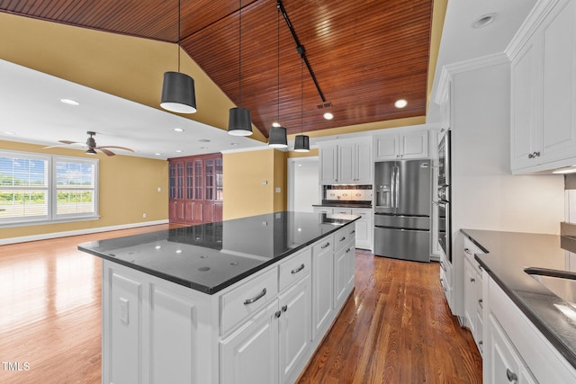 7390 NC-50, Angier, NC 27501 - kitchen featuring stainless steel appliances, dark countertops, wooden ceiling, wood finished floors, and a center island