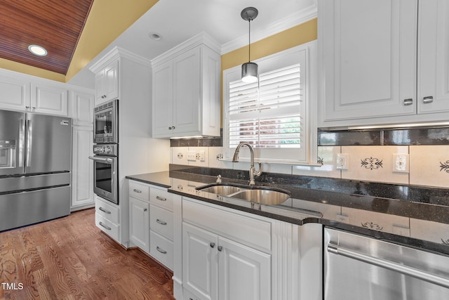 7390 NC-50, Angier, NC 27501 - kitchen featuring stainless steel appliances, white cabinetry, dark stone countertops, backsplash, and recessed lighting