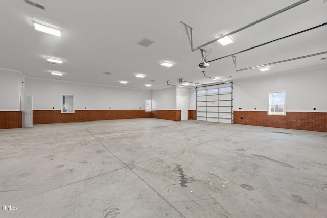 7390 NC-50, Angier, NC 27501 - garage featuring wainscoting and a garage door opener