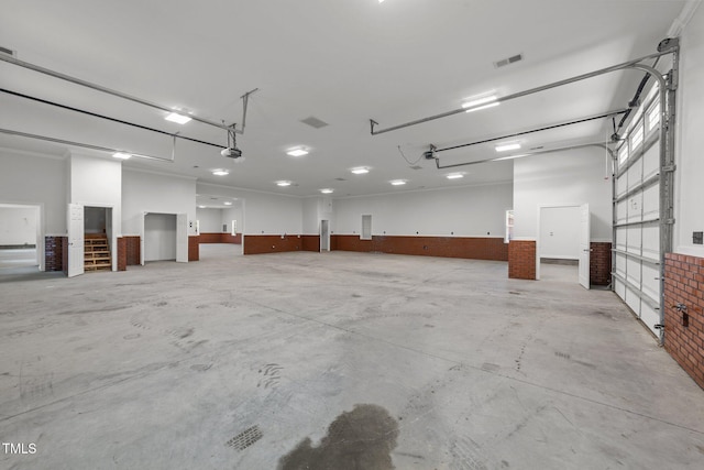 7390 NC-50, Angier, NC 27501 - garage featuring a wainscoted wall