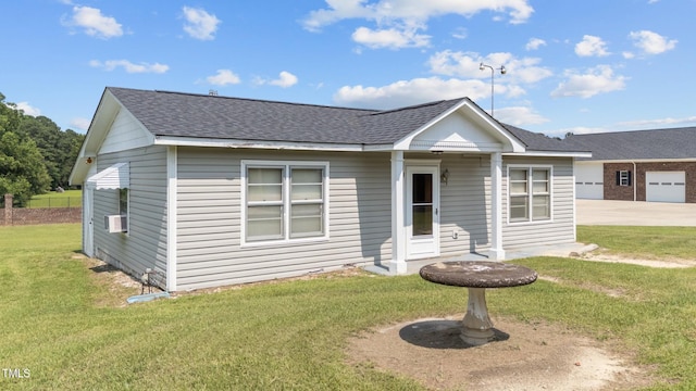 7390 NC-50, Angier, NC 27501 - bungalow-style home with roof with shingles, a front lawn, cooling unit, a garage, and concrete driveway