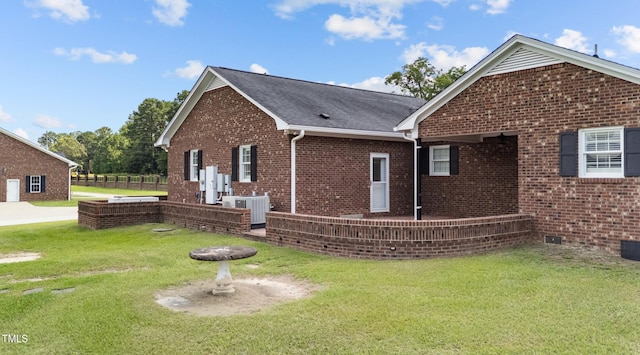 7390 NC-50, Angier, NC 27501 - view of side of property with brick siding, a lawn, a shingled roof, and crawl space