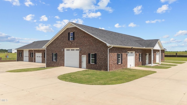7390 NC-50, Angier, NC 27501 - view of front of property with brick siding, a front lawn, concrete driveway, and a garage