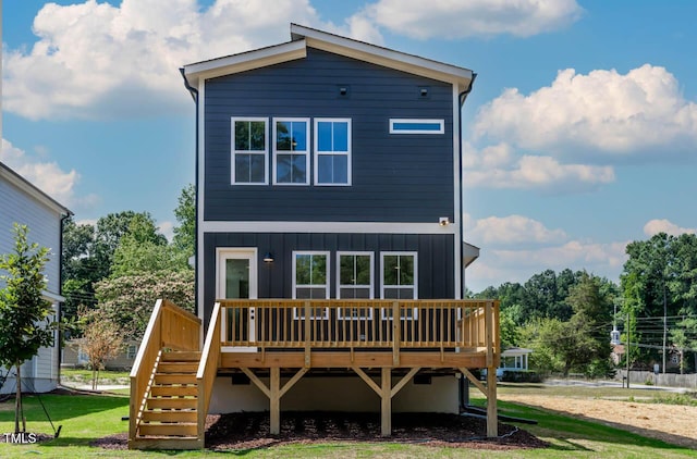 140 E End Ave, Durham, NC 27703 - view of front facade featuring a wooden deck, stairway, board and batten siding, and a front yard